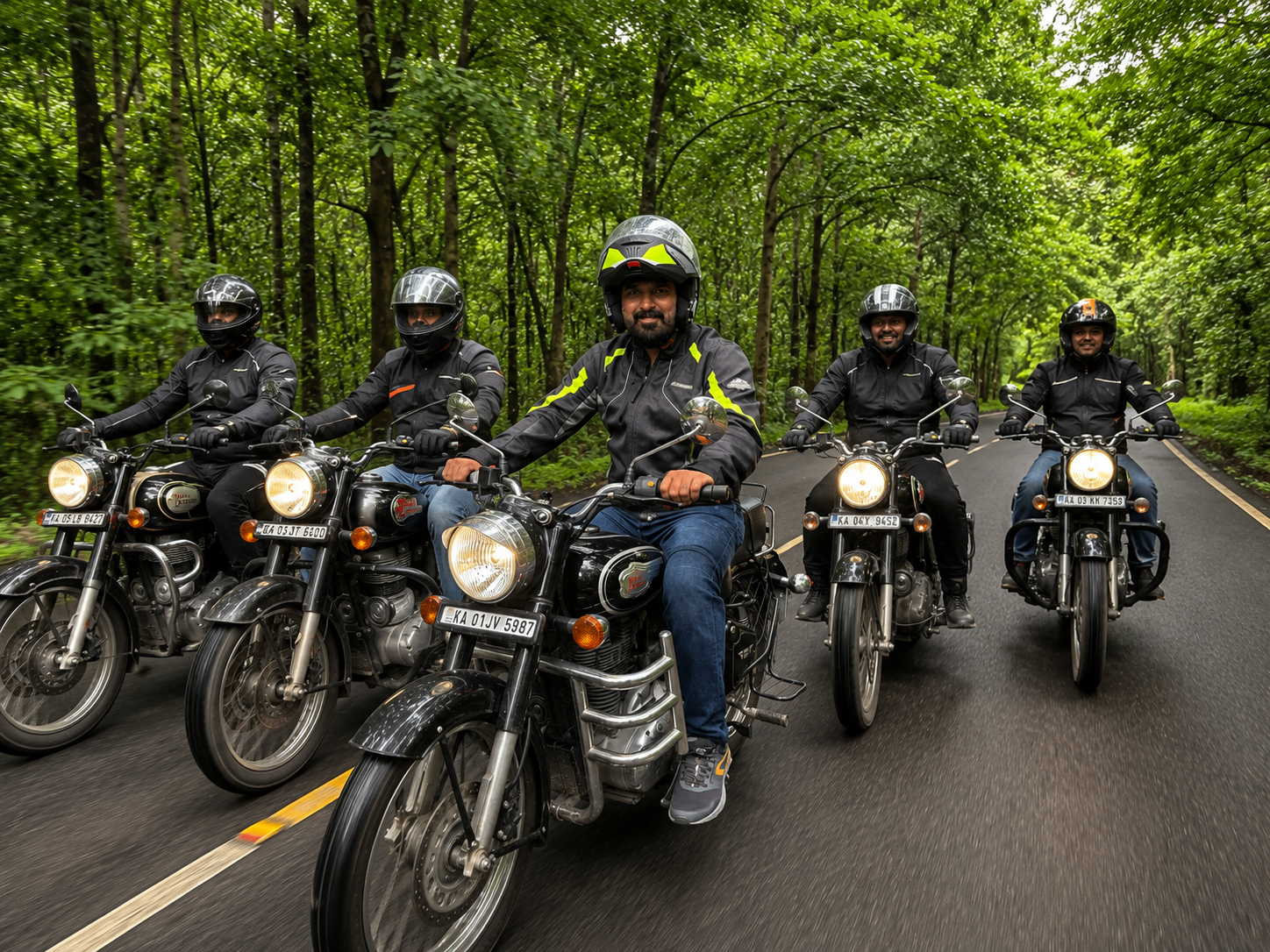 Group of riders together on a forest road